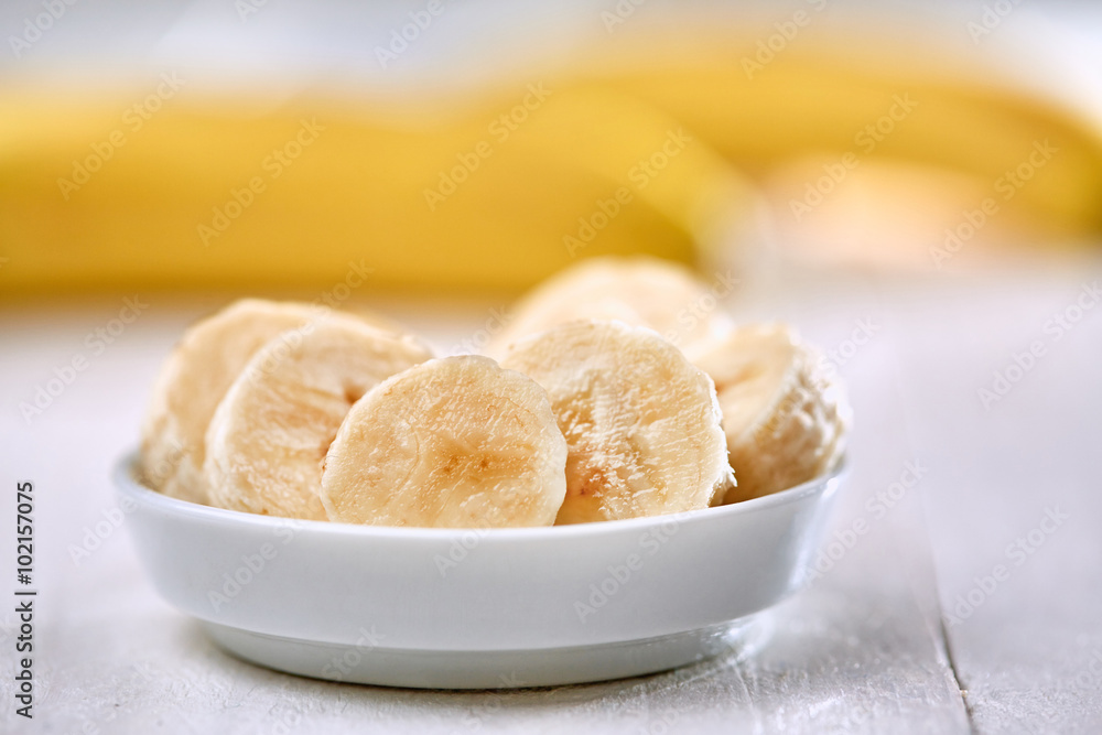 Fresh banana slices in bowl Fresh banana slices in bowl