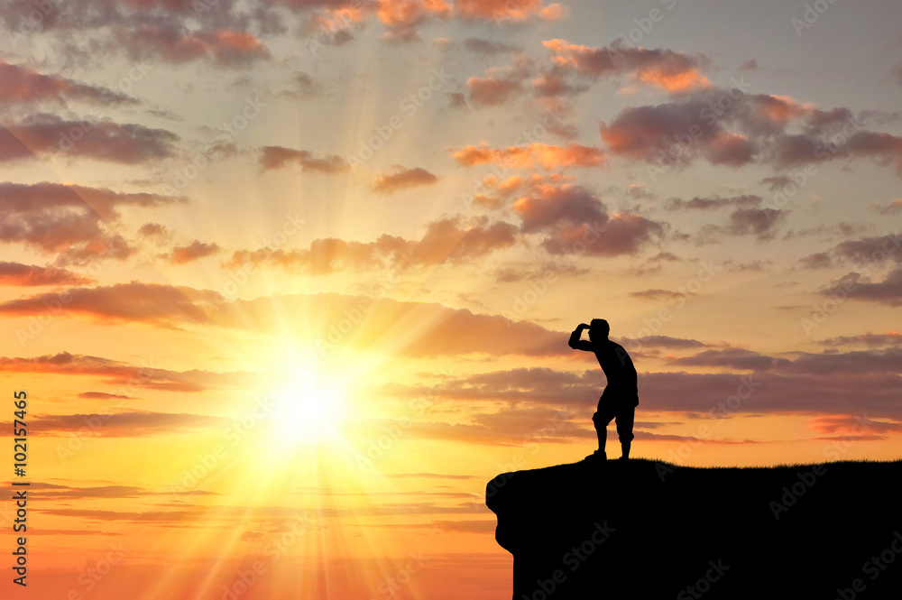 Silhouette  happy man on the mountain top