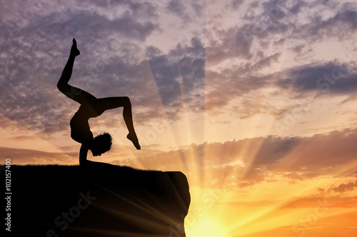 Canvas Print Silhouette of a girl practicing yoga