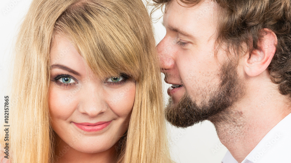 Man whispering to woman ear sharing secret. Man whispering to woman ear sharing secret.