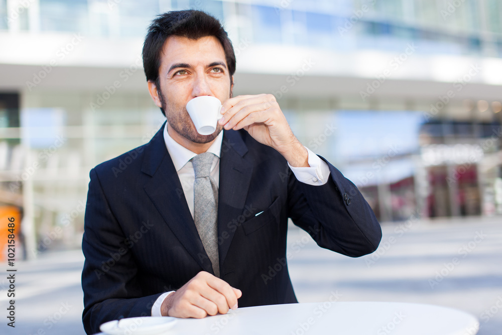 Portrait of a businessman drinking a coffee Portrait of a businessman drinking a coffee