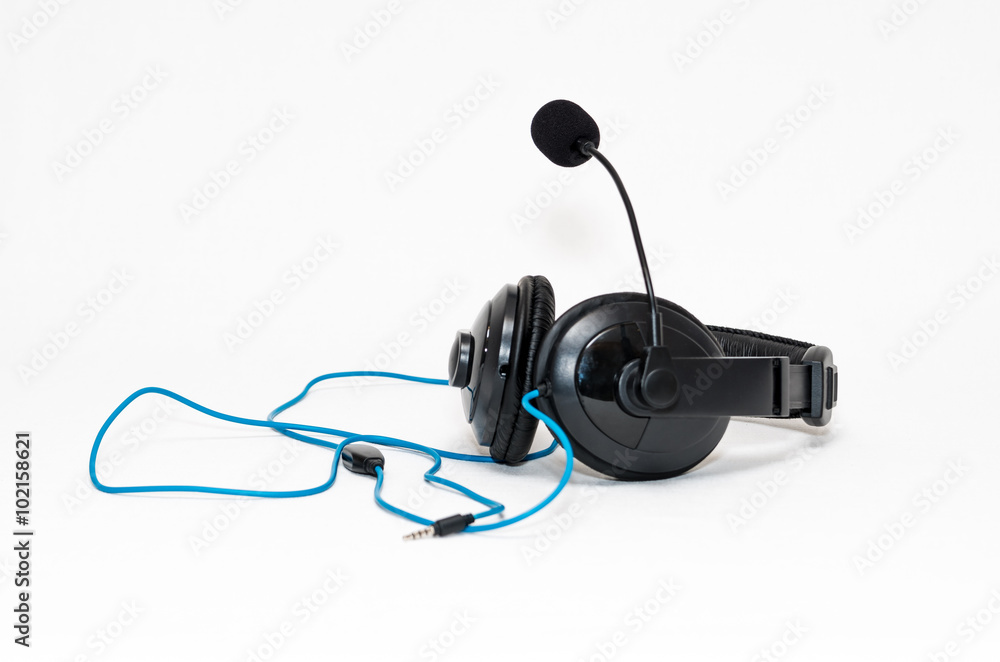 Headphones with a microphone and wire jack isolated on white bac Headphones with a microphone and wire jack isolated on white bac
