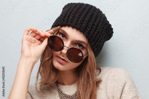 Emotive girl in stylish warm attire