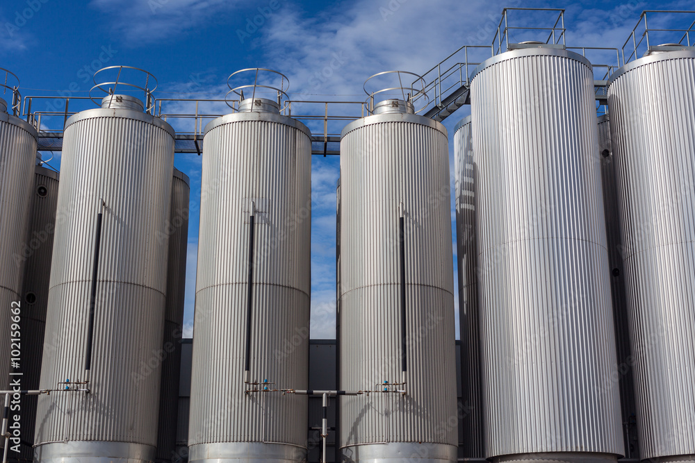 Giant industrial tanks on the bright blue sky Giant industrial tanks on the bright blue sky