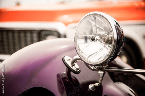 Classic car with close-up on headlights