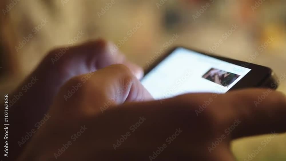 woman typing text on a smartphone, close-up woman typing text on a smartphone, close-up