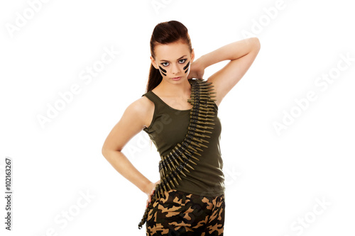 Serious military woman with bullet belt © Piotr Marcinski