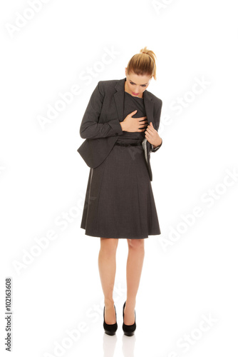 Young business woman having heart disease