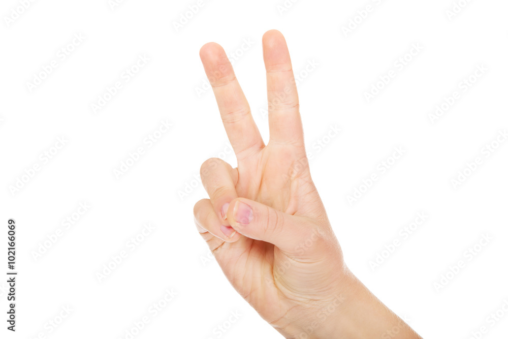 Woman hand shows two fingers - victory sign Woman hand shows two fingers - victory sign