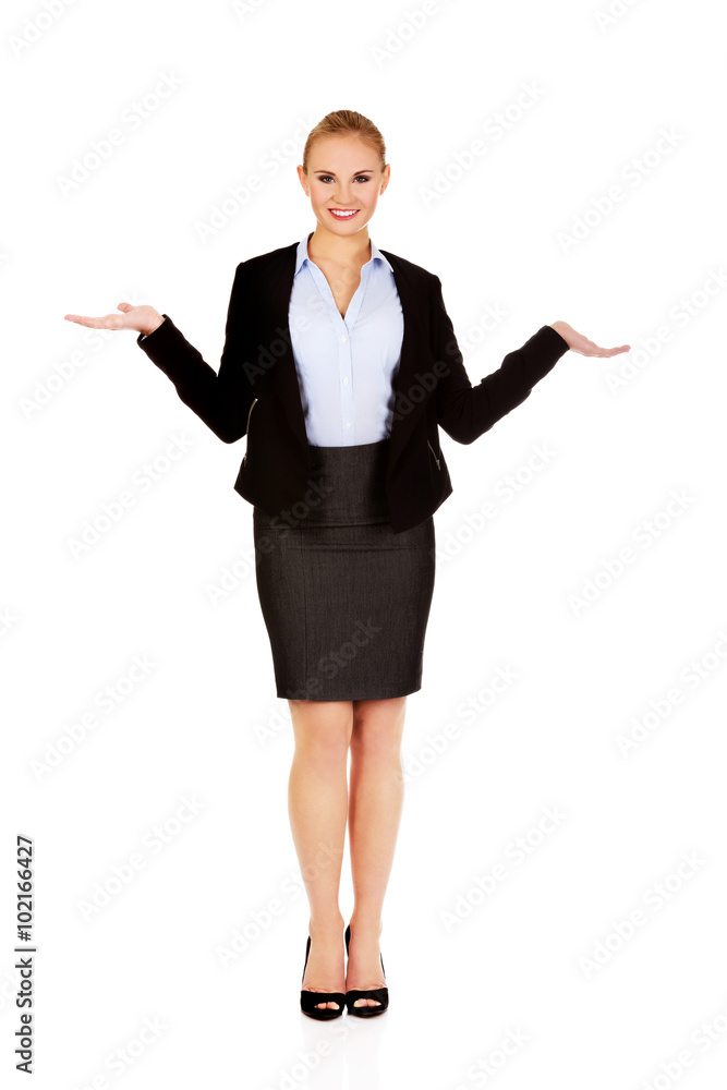 Business woman presenting something on open palm Business woman presenting something on open palm