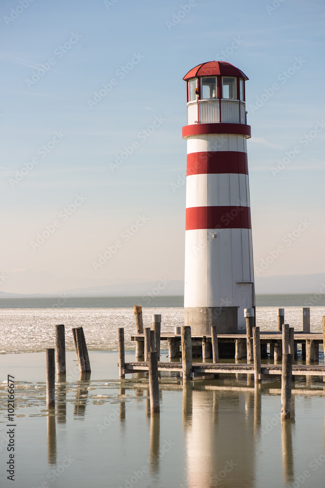 Lighthouse at the end of the wooden pier. Podersdorf am see, Austria