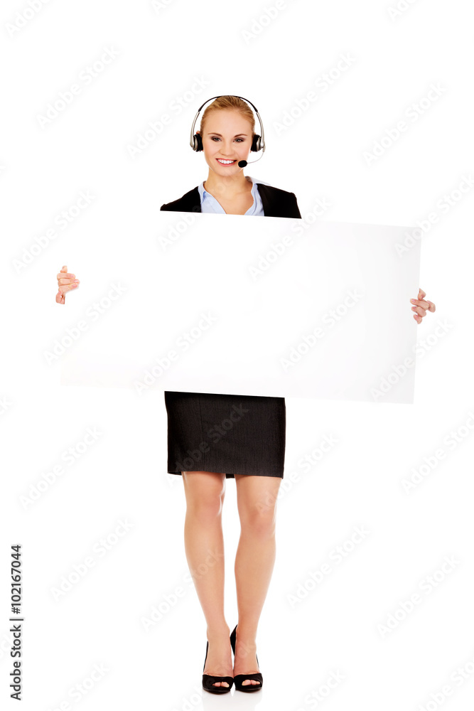 Smile call center woman holding empty banner Smile call center woman holding empty banner
