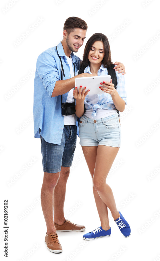 A pair of happy tourists sightseeing in summer, isolated on white A pair of happy tourists sightseeing in summer, isolated on white