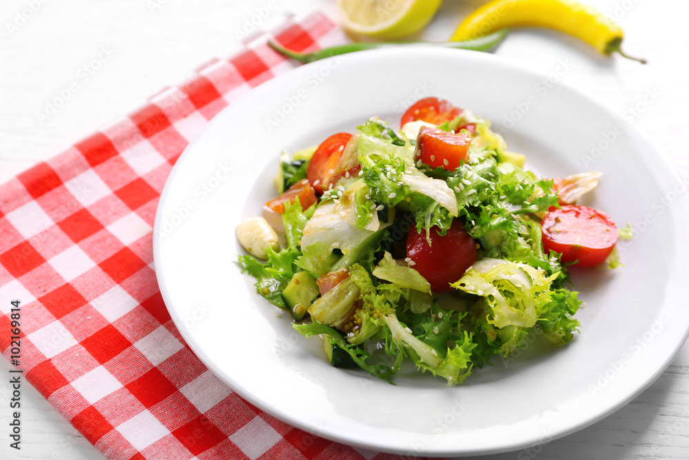 Tasty salmon salad on light wooden background Tasty salmon salad on light wooden background