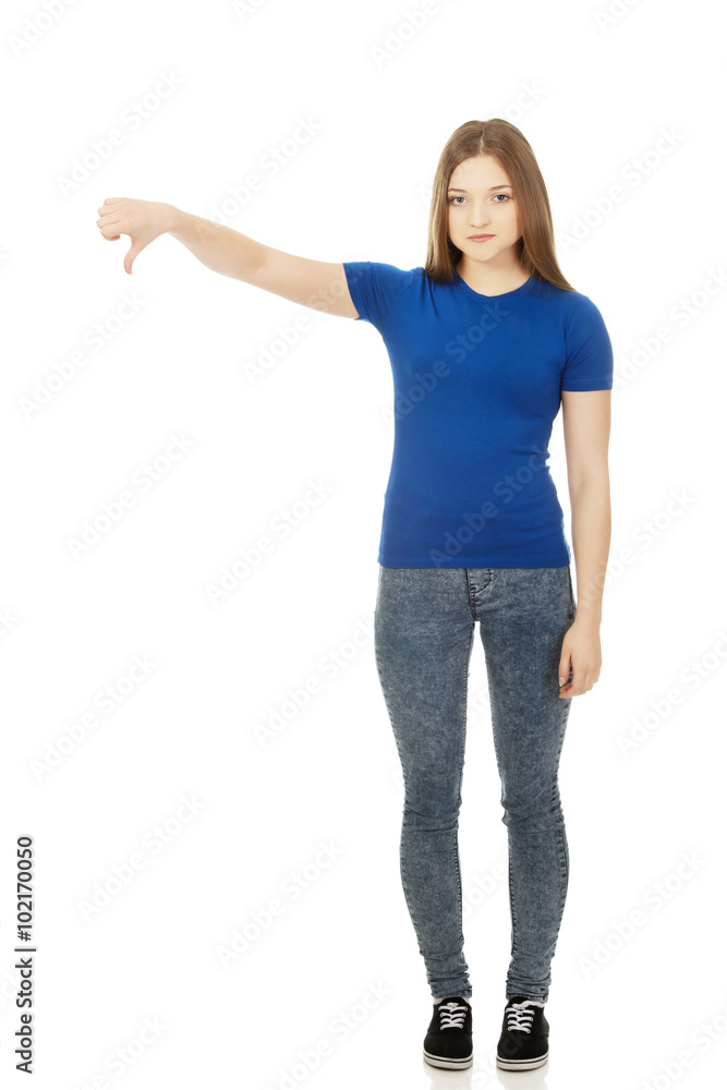 Young woman with thumbs down.