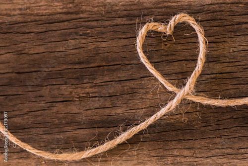 Heart made from string on natural background