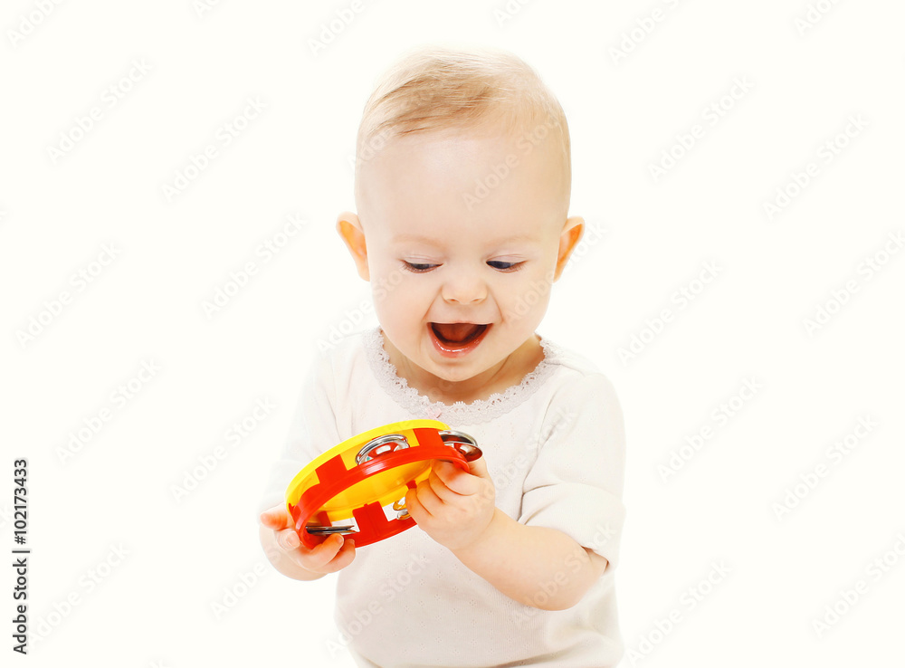 Happy smiling baby playing with toy on a white background Happy smiling baby playing with toy on a white background