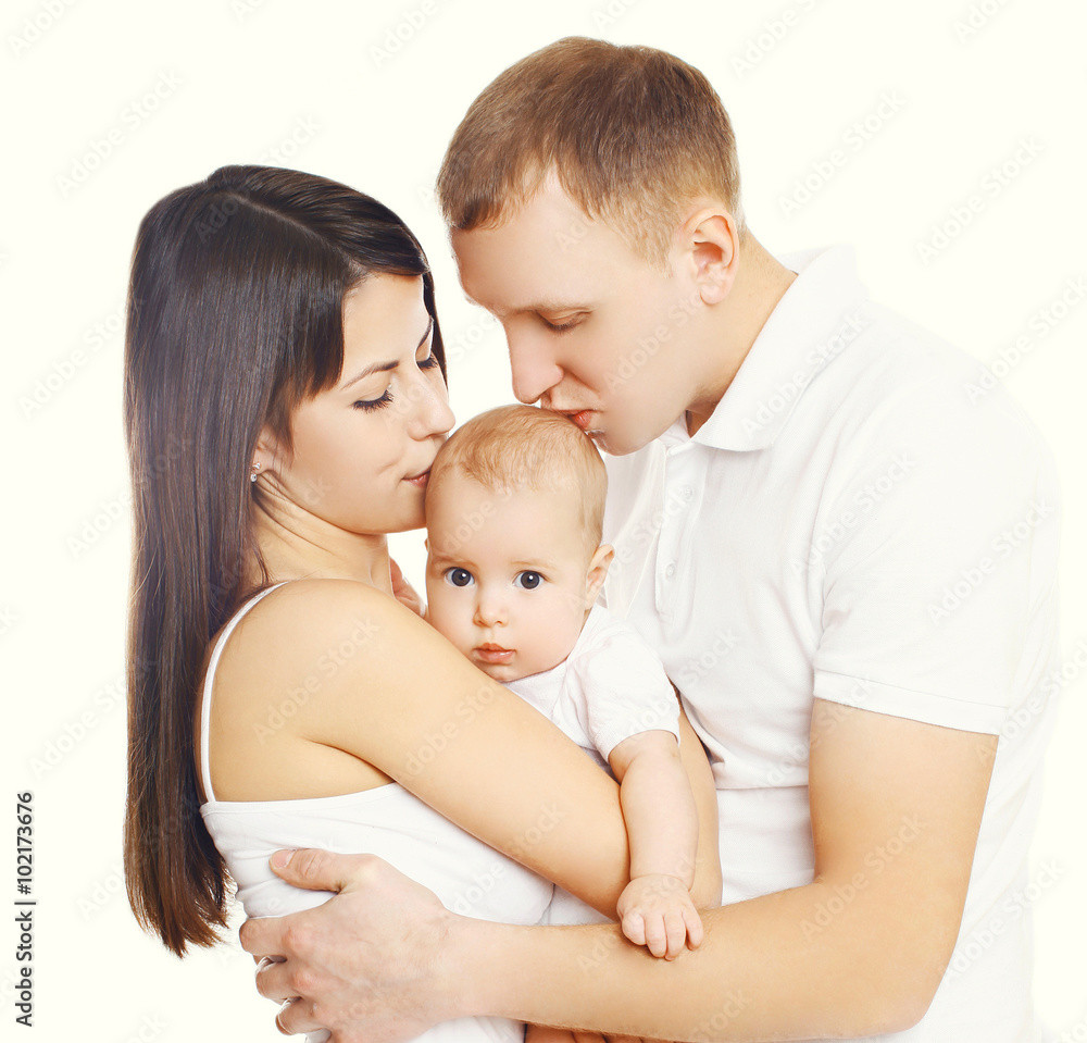 Mother and father kissing baby, happy family on a white backgrou Mother and father kissing baby, happy family on a white backgrou