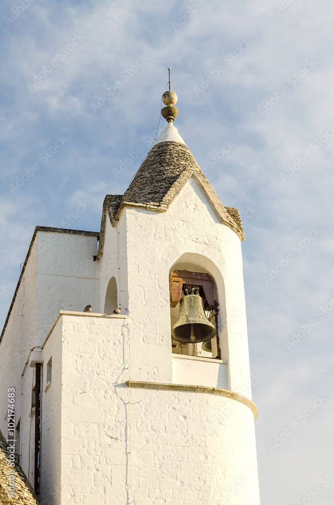 Belltower of the Trullo church in Alberobello, Italy
