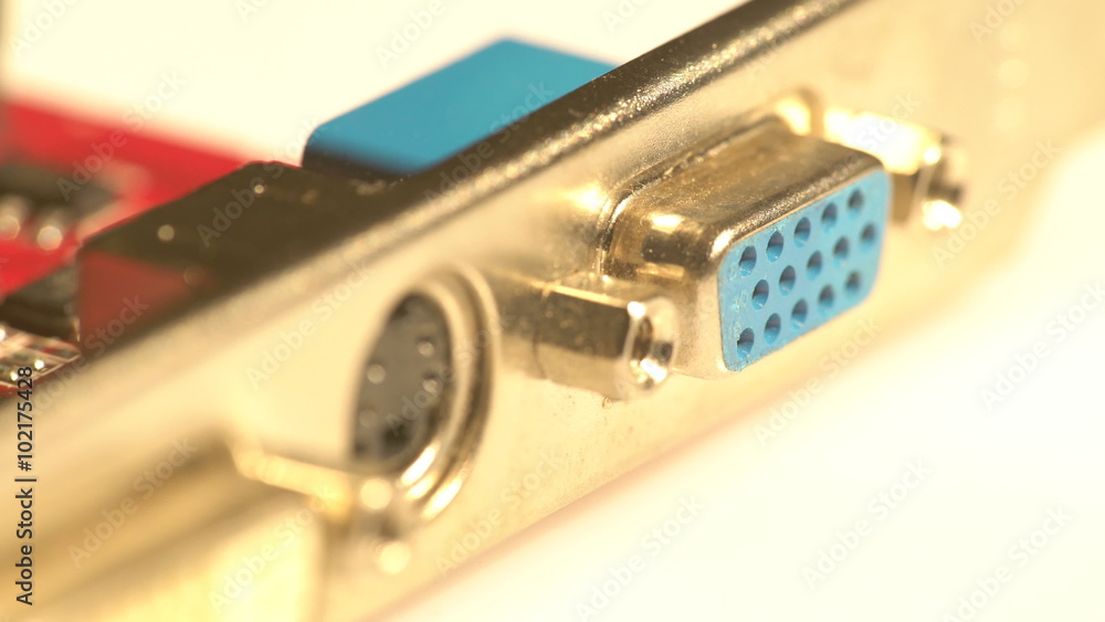 Macro view of a graphics card back with a standard VGA port and a moving light glare Macro view of a graphics card back with a standard VGA port and a moving light glare