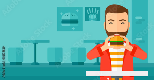 Man eating hamburger. 