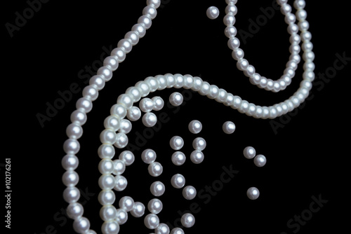 beautiful pearls on black background