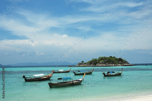 Fishing boats on the sea with blue sky background, Li-Pe Thailan