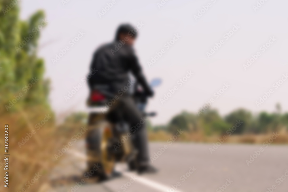 Biker man sits on a motorcycle Biker man sits on a motorcycle