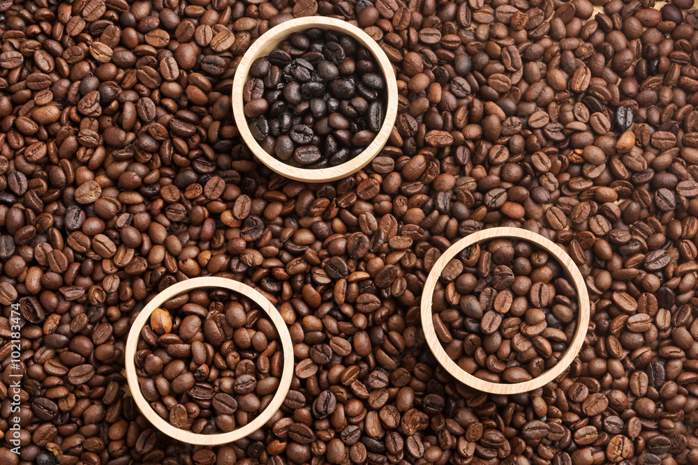 Various types of Coffee Beans in the wooden bolw, coffee bean background