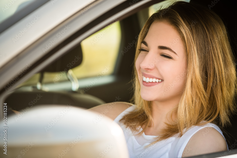 Young woman driving car