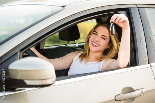 First car - young woman with keys © Martinan
