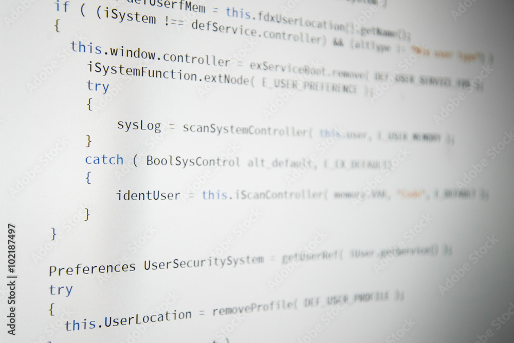 Software developer programming code. Abstract computer script code. Shallow depth of field, selective focus effect.