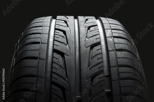 new tire, just bought , on an isolated dark background