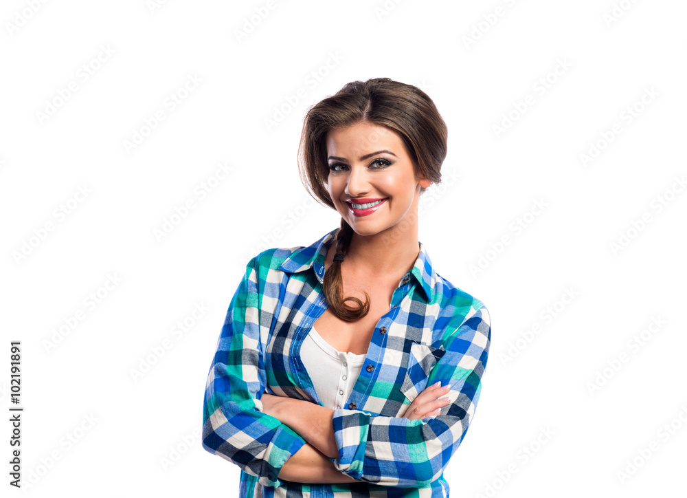 Woman with plait in blue and green checked shirt smiling Woman with plait in blue and green checked shirt smiling
