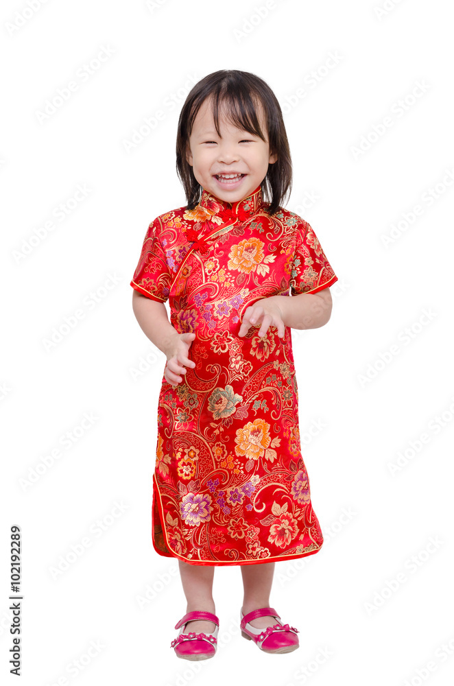 Little chinese girl in traditional dress smiles over white Little chinese girl in traditional dress smiles over white