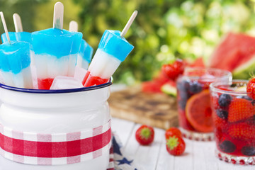 Red-white-and-blue popsicles on an outdoor table