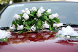 beautiful bouquet of ornamental flowers on the hood of the car