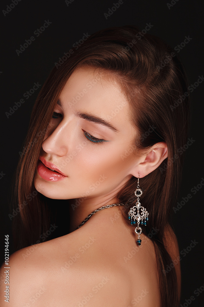 Sensual glamour portrait of beautiful young woman