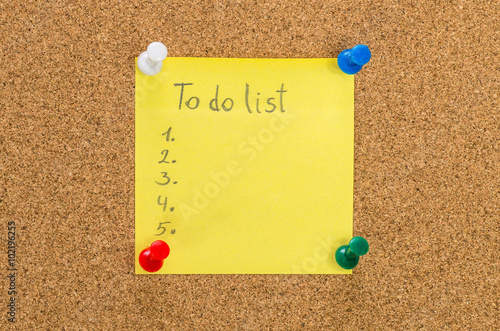 To do list note pinned to corkboard background