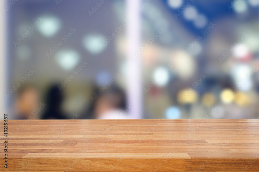 Empty wooden table and blurred cafe background Empty wooden table and blurred cafe background