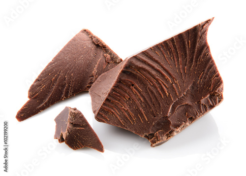 Chocolate pieces isolated on white.