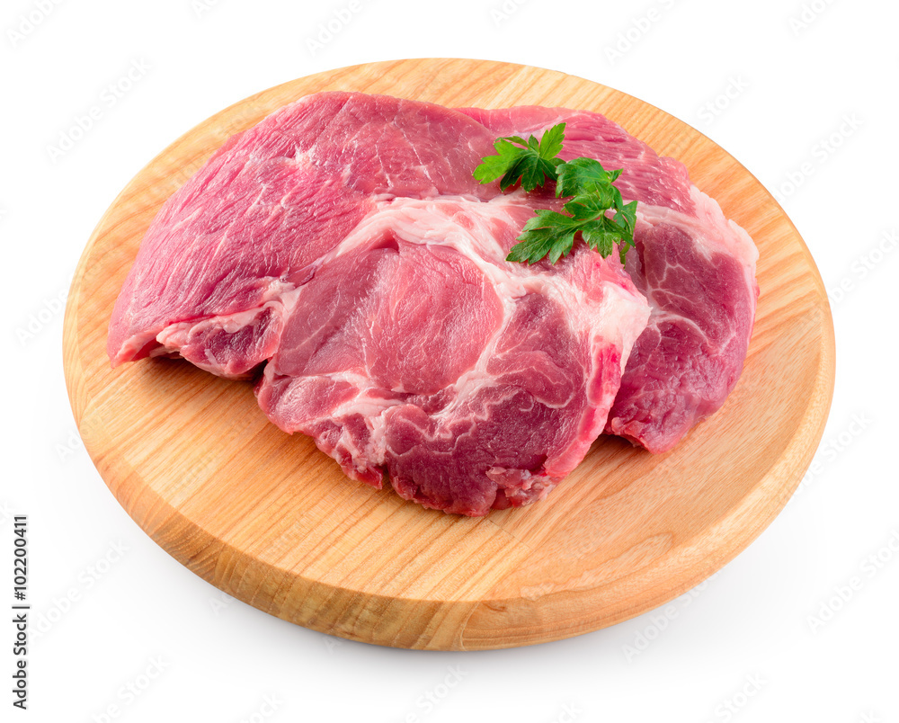 Fresh raw meat on wooden cutting board. With clipping path. Fresh raw meat on wooden cutting board. With clipping path.