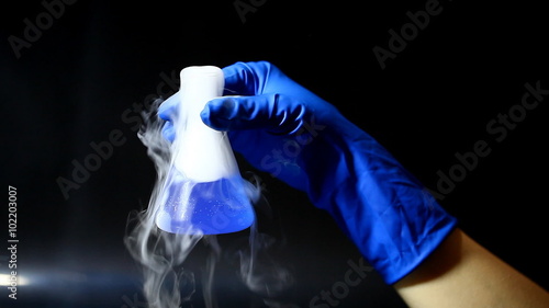 chemical glass bottle in hand 