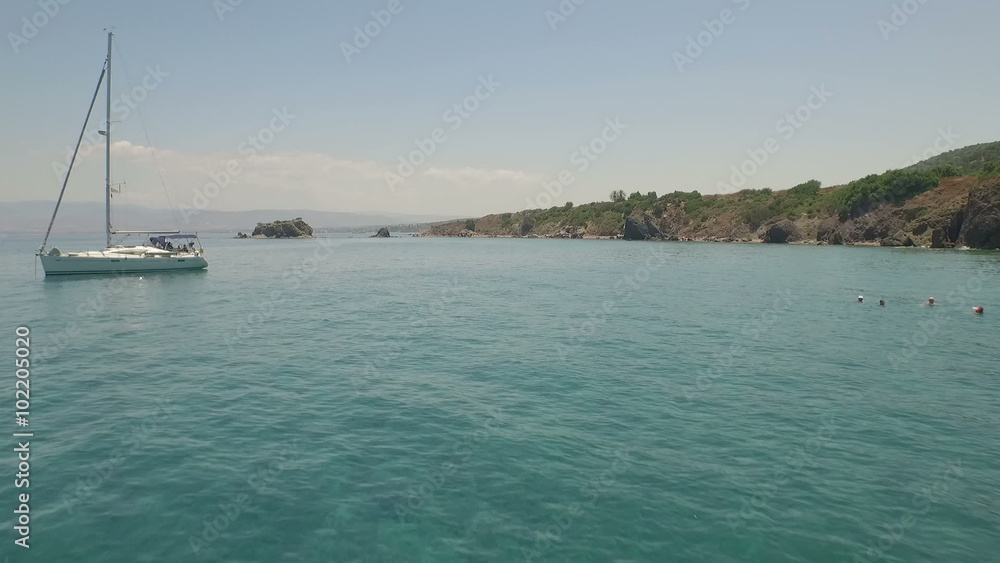 Aerial / Drone shot along the coast of Cyprus passing a boat
Aerial / Drone shot along the coast of Cyprus passing a boat