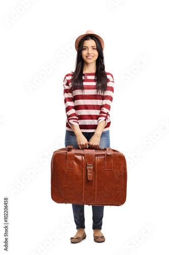 Cheerful young woman holding a briefcase