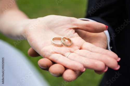 Wedding rings gold outdoors 