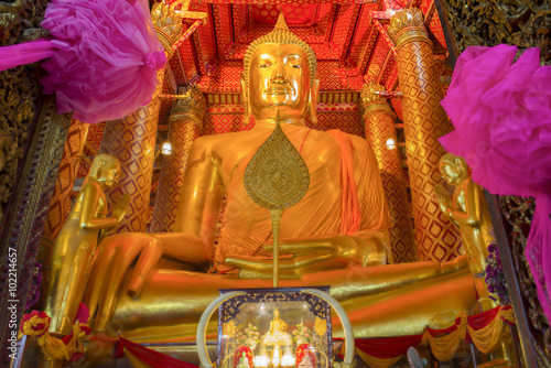 Golden color The Buddha Statue in the ubosot at Wat Phanan Choen photo