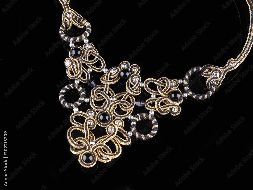 handmade necklaces on a black background handmade necklaces on a black background