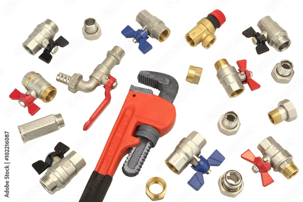 Adjustable Wrench And Many Ball Valves Isolated On White, Close Adjustable Wrench And Many Ball Valves Isolated On White, Close