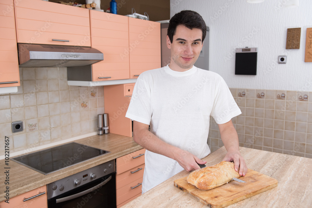 man cutting bread man cutting bread